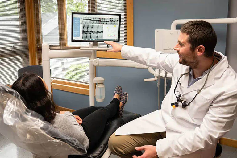 Dr. Janiga discussing dental care with a patient